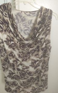 Sophisticated drape neck sleeveless top, perfect for Spring and Fall!